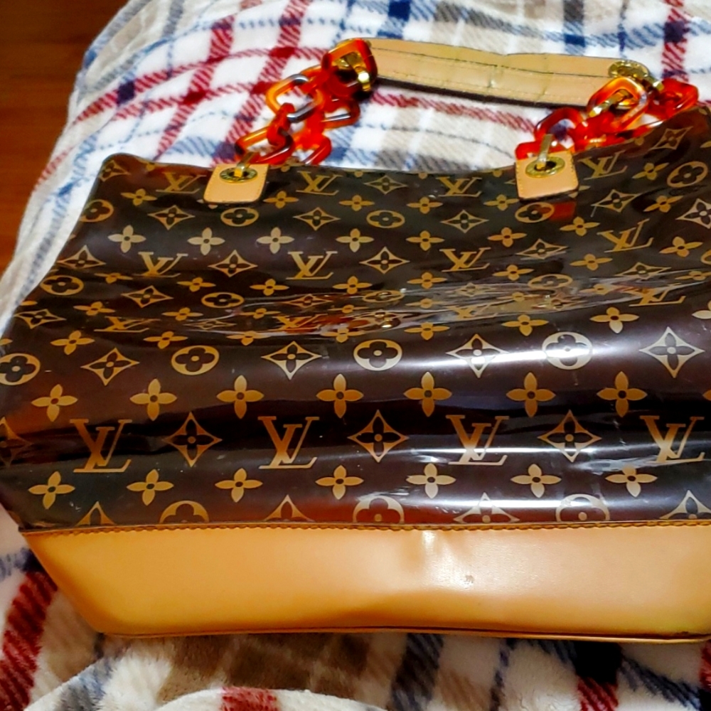 Louis Vuitton satchel, brown or tan in color, lovingly worn, stylish & classy.
